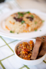 pilaf and salad, black bread on the table