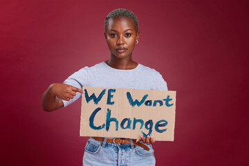Black woman, cardboard sign and protest for change, end racism and equality for people on studio...
