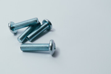 Steel screw. Screws on white background. Some metal machine screw bolts on white background.