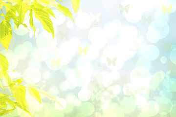 Obraz na płótnie Canvas Hello spring background. Yellow maple in spring over abstract bright spring or summer landscape texture with butterflies. Space for sale offer. Beautiful backdrop.