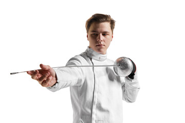 Young man, male fencer in fencing costume mask standing with sword over white studio background....