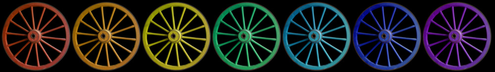 Roues de charrettes couleurs arc-en-ciel, fond noir
