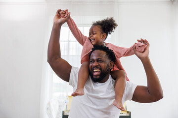 enjoy happy love black family african american father carrying daughter little african girl child smiling and having fun moments good time. Happy black African American father day concept. - Powered by Adobe