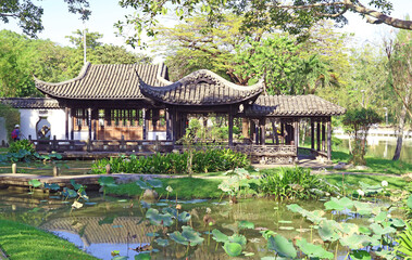 Obraz premium Traditional Chinese Garden with Stunning Viewing Pavilions on Water Lilies Pond