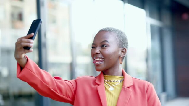 Travel, happy and black woman taking a selfie in the city with a peace sign and silly face expressions in the street. Happiness, goofy and African female taking a picture and blowing a kiss in town.