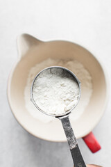 All purpose flour in a measuring cup, one cup of flour