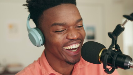 Podcast, headphones and microphone black man creative DJ, presenter or speaker in radio station or music recording studio. African live streaming, online content influencer and internet personality - obrazy, fototapety, plakaty