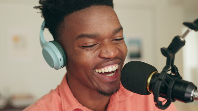 Podcast, headphones and microphone black man creative DJ, presenter or speaker in radio station or music recording studio. African live streaming, online content influencer and internet personality