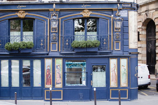 Paris, France - May 31, 2022: Facade of an old Parisian house of medieval architecture - tourist architectural landmarks