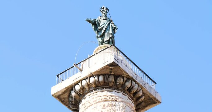 Saint Paul statue on top of the Column of Marcus Aurelius in Rome, Italy.