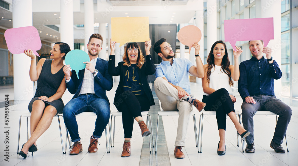 Aufkleber Im the ideal candidate because...Shot of a group of businesspeople holding colorful speech bubbles while waiting in line in a modern office.