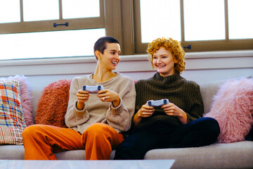 Female couple playing video game