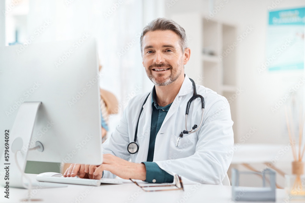 Canvas Prints Research is what allows me decide how to best treat patients. Portrait of a mature doctor working on a computer in a medical office.