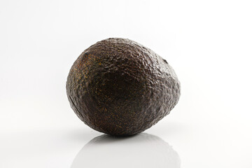 Close-up, whole avocado on a white background