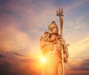 The huge Shiva statue Mangal Mahadev is a 33 m art piece in Ganga talao temple on the blue evening...