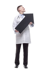 smiling young doctor pointing in the right direction.