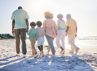 Family walk on the beach, holding hands and generations with travel and summer vacation, solidarity...