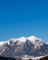 snow covered mountains with blue sky