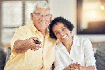Portrait of senior couple watching tv on sofa with comedy show, film or movies at home together with love and hug. Biracial people or woman with elderly partner watch television and relaxing on couch