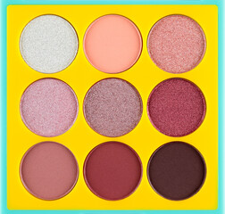 Palette of eyeshadow isolated on white background, top view