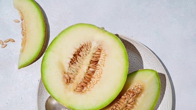 Cantaloupe, melon fruit slice over bright background. 