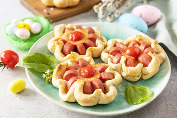 Idea for Easter breakfast or lunch. Mini pizza. Pizza in puff pastry with cheese and tomatoes on...