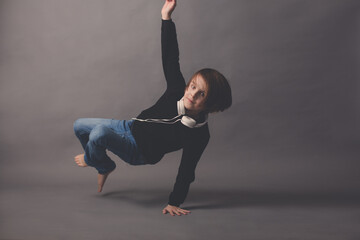 Sweet child, boy in black sweater, listening music