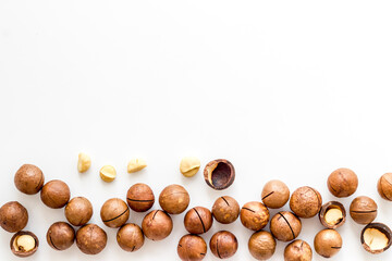 Obraz na płótnie Canvas Flat lay of macadamia nuts, top view. Healthy protein food background