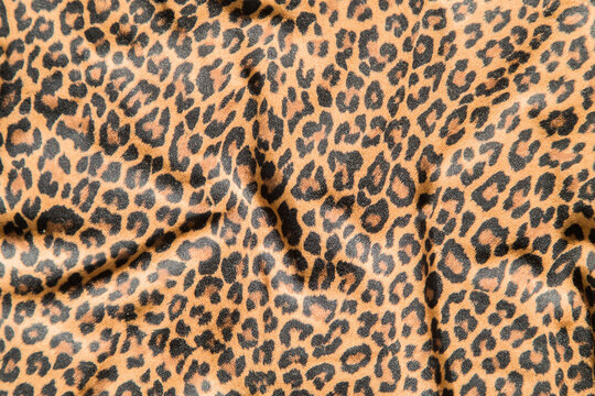 Leopard effect, fabric pattern. Background sample, seamless background print texture. Animal textil design.