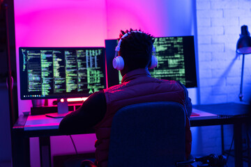 Software developer coding on his computer. Coding and hacking concept.