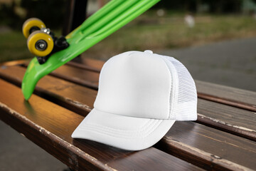 Trucker cap, snapback, all white, white mesh. In location on playground. Mock-up for branding