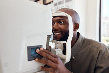 Seeing better starts right now. Shot of a young man getting his eyes examined with an autorefractor.