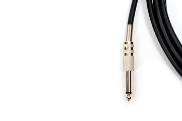 Long black jack cord for electric guitar, filmed on a white background.