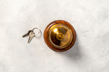 Hotel service bell with keys. Booking and checkin concept