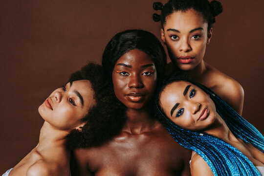 Beautiful black women wearing lingerie underwear posing in studio - Multicultural female models posing in studio on background, concepts about diversity, real authentic people, women's right