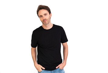 Handsome male model is posing in a black t-shirt and jeans smiling and looking happy. Black mock-up.
