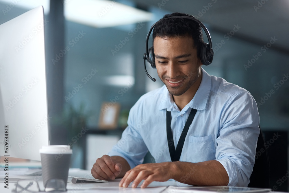 Poster If you need anything else, Im your guy. Shot of a young man using a headset and computer in a modern office.