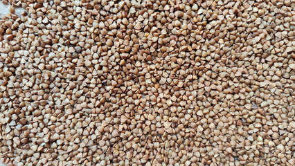 Brown buckwheat groats for background and texture