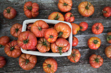 Vegetables, tomatoes on wooden desk