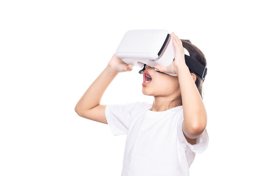 Kid using virtual reality headset, surprised child looking in VR glasses isolated on white background with clipping path.