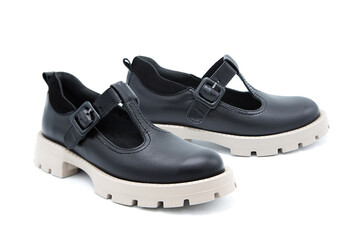 Pair of fashionable leather sandals isolated on white background.