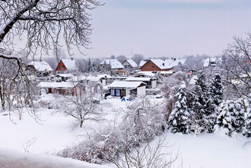 snowy allotment garden and single family house settlement on the outskirts of Berlin