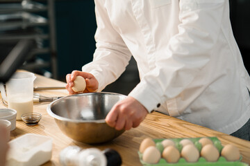 Professional kitchen chef prepares pancakes