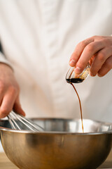 Professional kitchen chef prepares pancakes