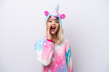 Obraz na płótnie Canvas Young Russian woman with unicorn pajamas isolated on white background with surprise and shocked facial expression