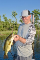 An angler with a largemouth bass 