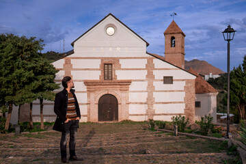 One Man's Reverent Gaze Upon the Magnificent Architecture of a Church.