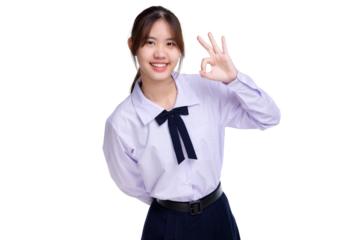 Happy pretty Asian student girl in school uniform shows OK hand sign isolated on transparent background, PNG file format.