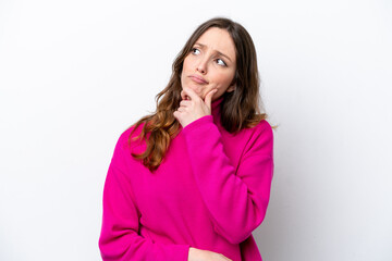 Fototapeta premium Young caucasian woman isolated on white background having doubts