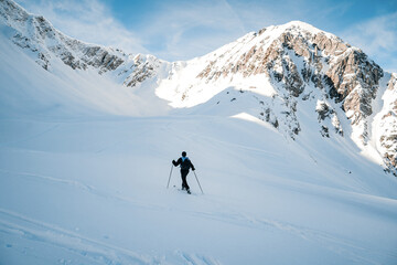 Fototapeta na wymiar Ski tour in a beautiful winter landscape. Ski mountaineering. Mountains covered with snow 